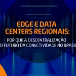 Corredor de data center com racks de servidores, simbolizando o edge computing e a descentralização da conectividade no Brasil.
